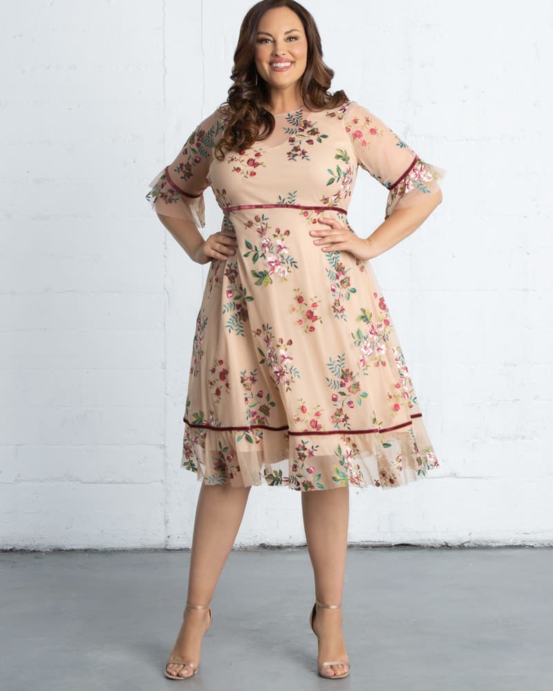 Front of a model wearing a size 0X Wildflower Embroidered Dress in BLUSH by Kiyonna. | dia_product_style_image_id:227147